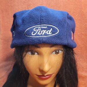 Vintage FORD CANDA newsboy cap made of blue fleece material.